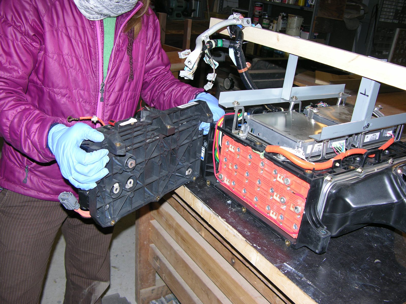 Honda Insight IMA battery pack cover removed, exposing orange interconnect